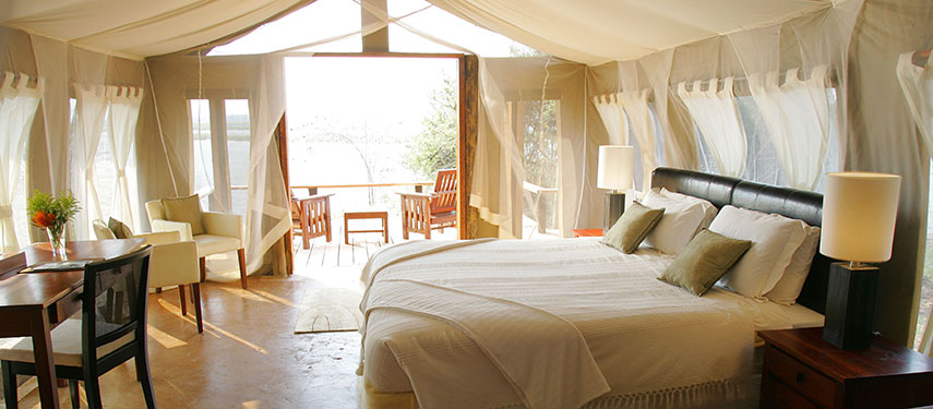 Sit out on the terrace overlooking the river at the Royal Zambezi