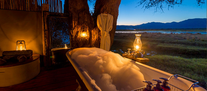 Luxurious bath at sunset at Ruckomechi Camp, Mana Pools National Park, Zimbabwe