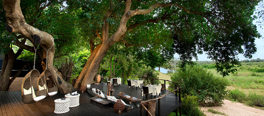 Dine on the banks of the Sabi River at Lion Sands Tinga Lodge in South Africa