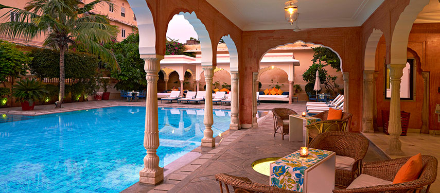 The exquisite pool and poolside bar at the iconic Samode Haveli in Jaipur