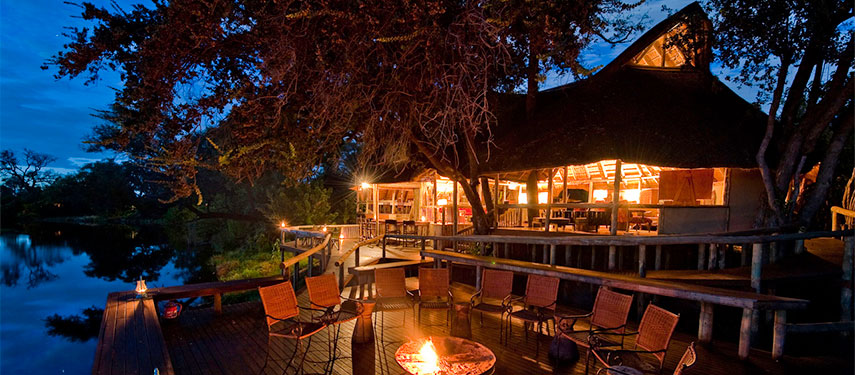 Savuti Camp safari lodge dining area at night in Botswana