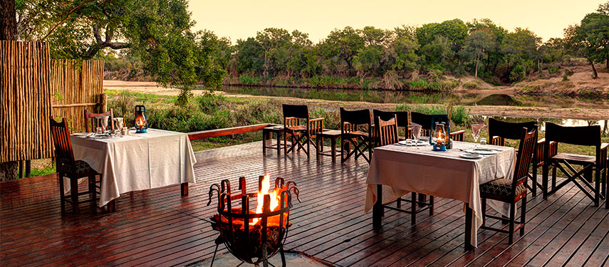 Dinner with a view of the riverbank at Simbavati River Lodge in South Africa