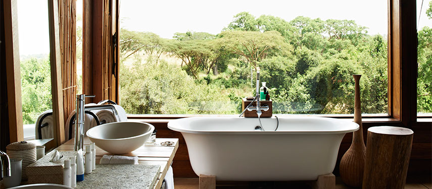 Bathtubs reminiscent of colonial East Africa at Singita Faru Faru