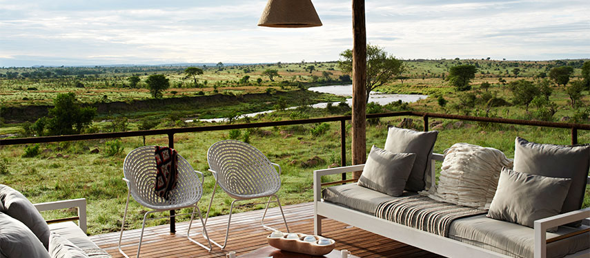 Sit on the deck at Singita Mara River Tented Camp and wait for the wildlife to come to you