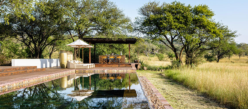 Relax by the pool with your group at Singita Serengeti House