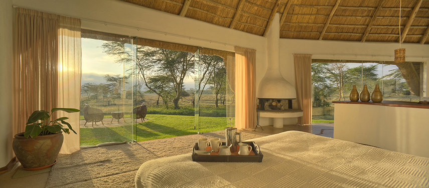 Spacious and luxurious cottages offer panoramic views of the nearby hills at Solio Lodge