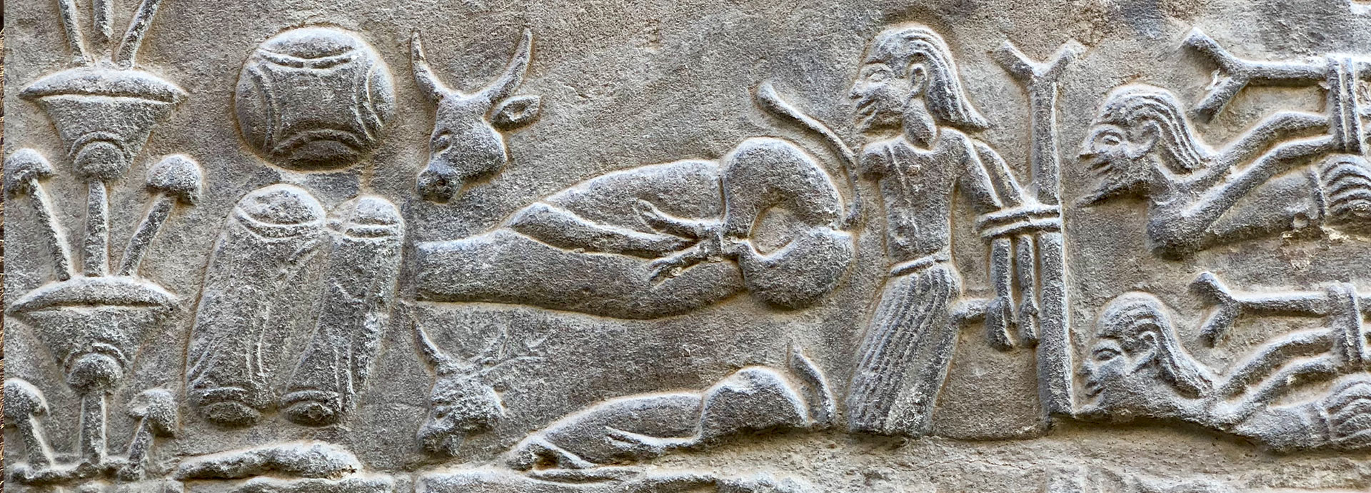 Stone hieroglyphs carved into a wall