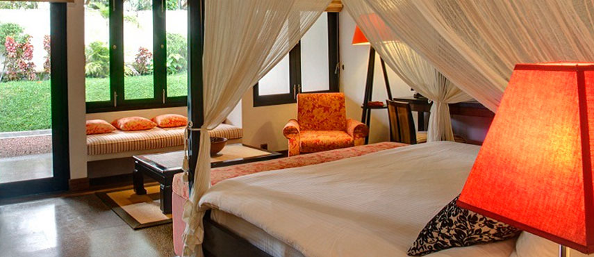 The Wallawwa's bedrooms and suites blend 18th century colonial character with bold contemporary design and four-poster beds.