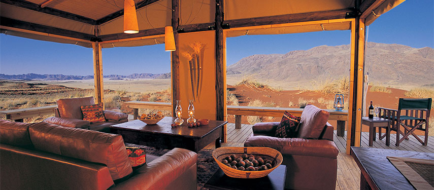 An indulgent lounge with panoramic mountain views at Wolwedans Mountain View Suite