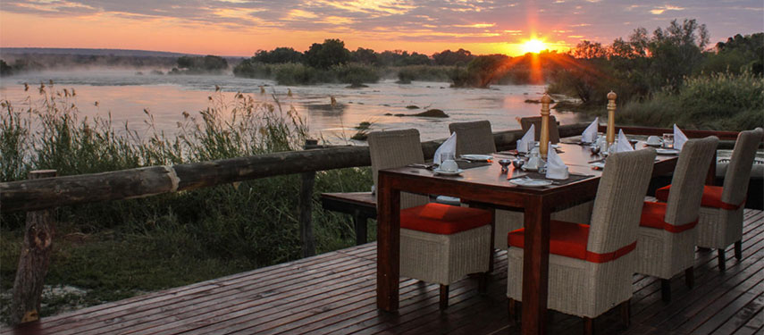 Breakfast by the river with sunset views at Zambezi Sands River Camp
